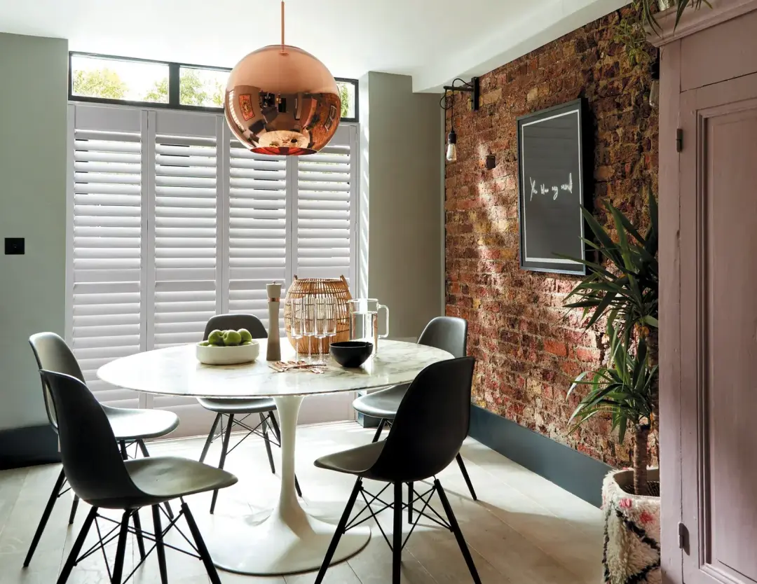 Caf&eacute; style plantation shutters for street-facing rooms