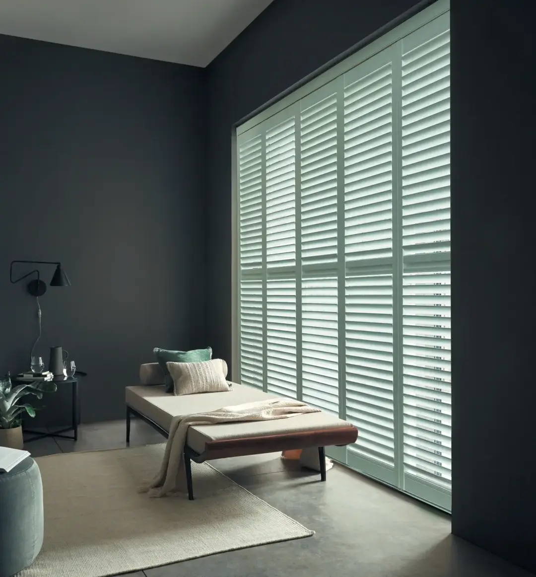 Full height plantation shutters fitted in a bright Swansea living room
