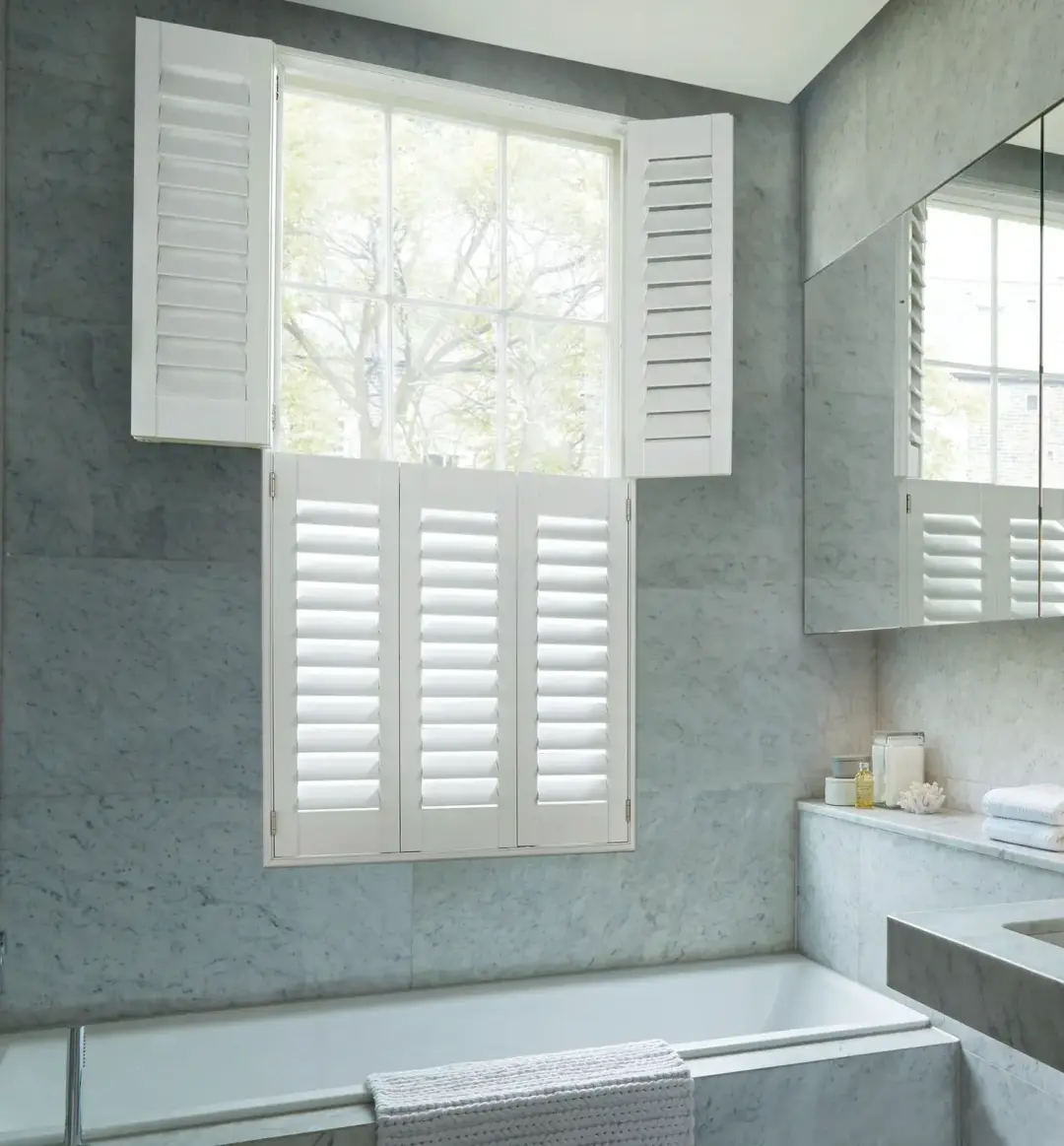 Water-resistant shutters fitted for privacy in a Swansea bathroom